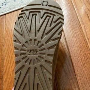 Tan, furry UGG slippers, women’s size 8. Never worn outside, worn twice inside.